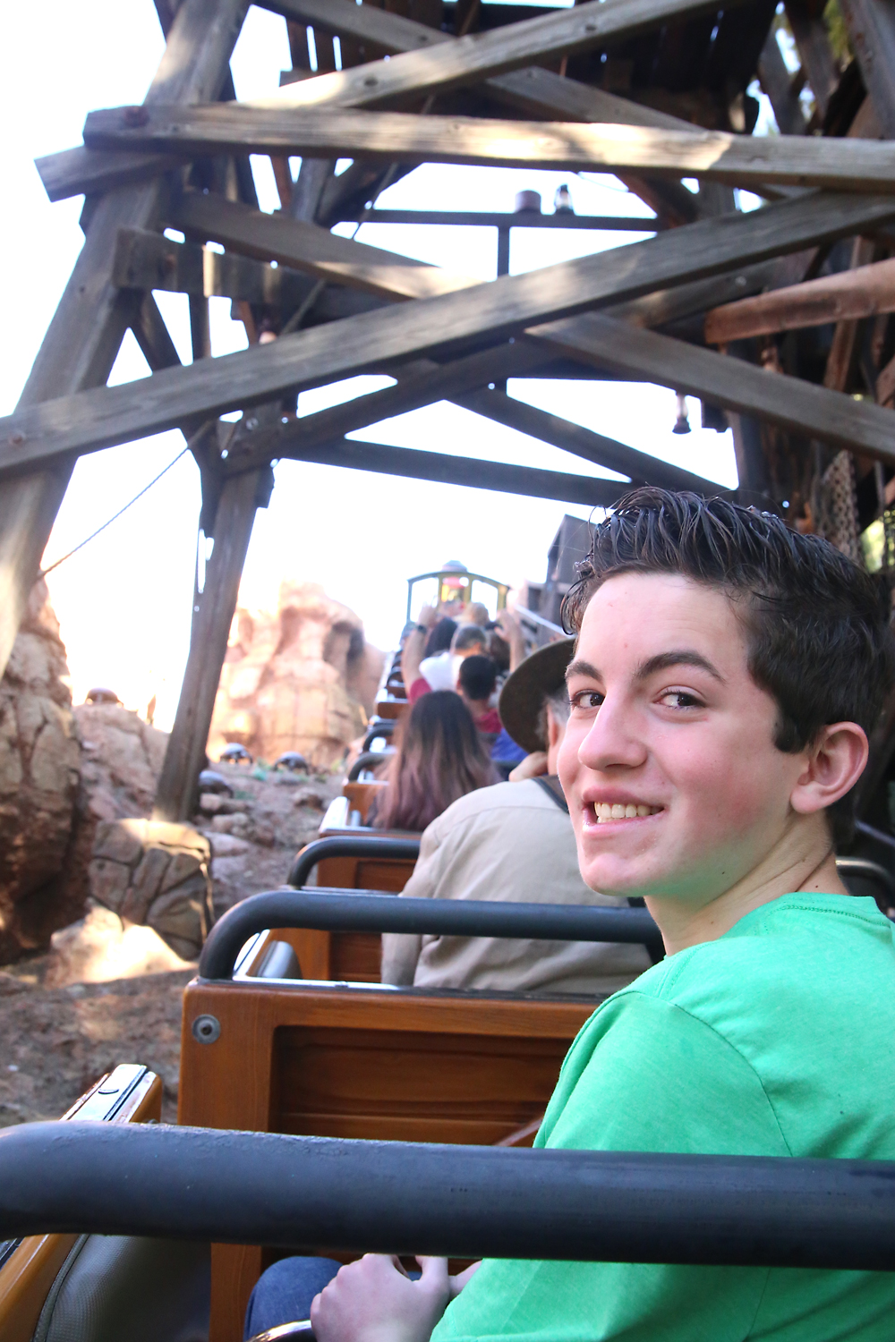 Teenage boy on a roller coaster at Disneyland