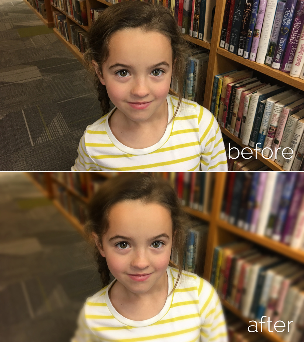 A little girl smiling next to a book shelf, same photo with the background blurred
