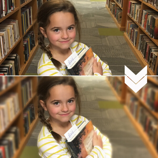 A little girl standing in a library; same photo with the background blurred