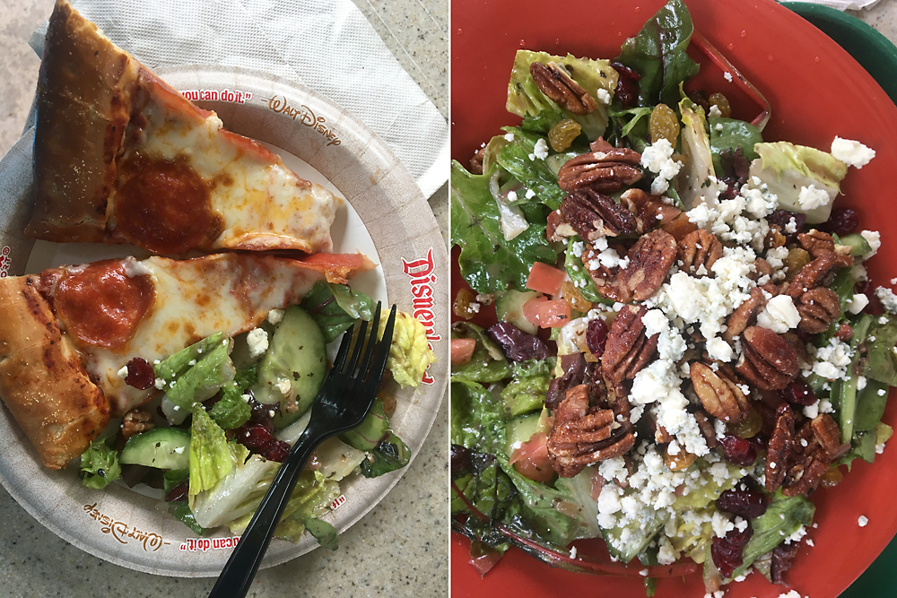 Two slices of pizza on a paper plate with a large salad