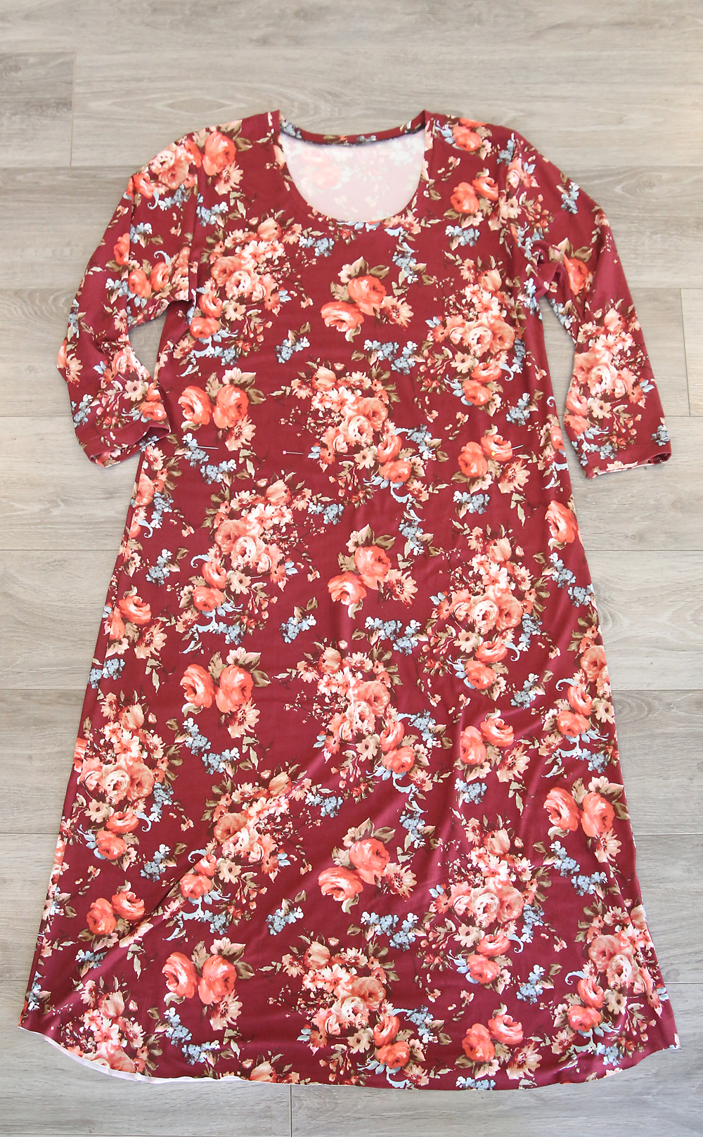 A midi length t-shirt dress laying on the floor