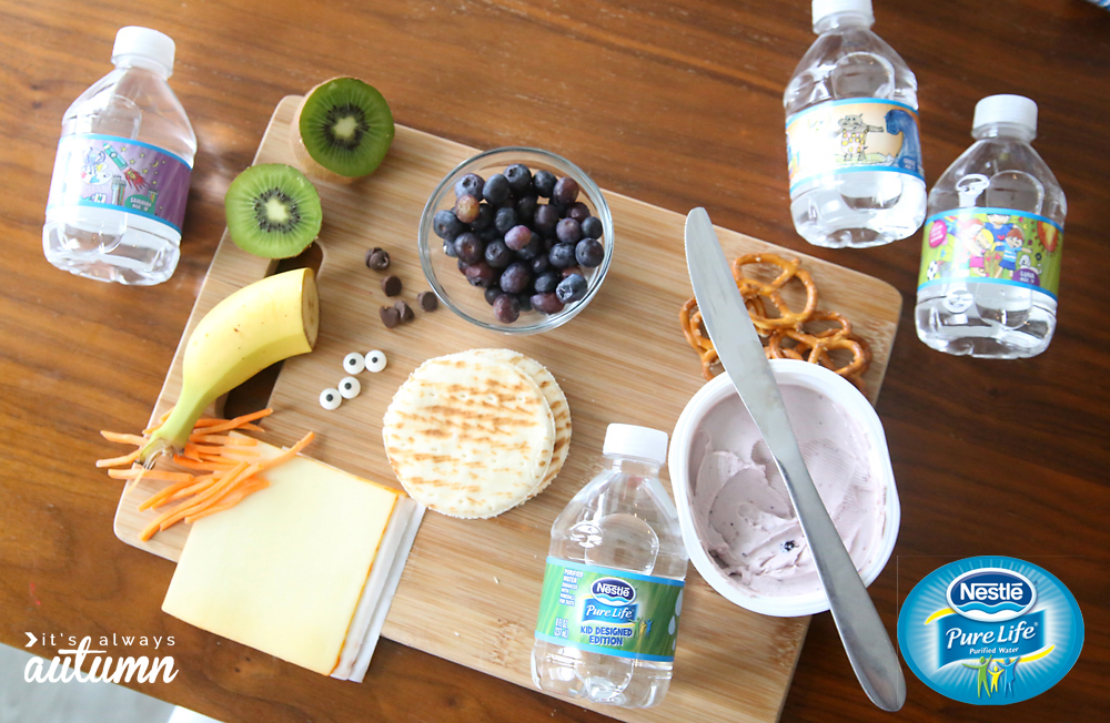 Supplies for silly snacks: pita bread, cheese, fruit, cream cheese, pretzels, candy eyes