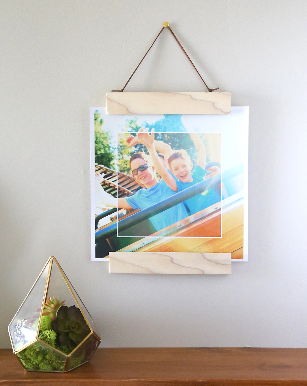 DIY modern wood and magnet photo frame hanging on the wall