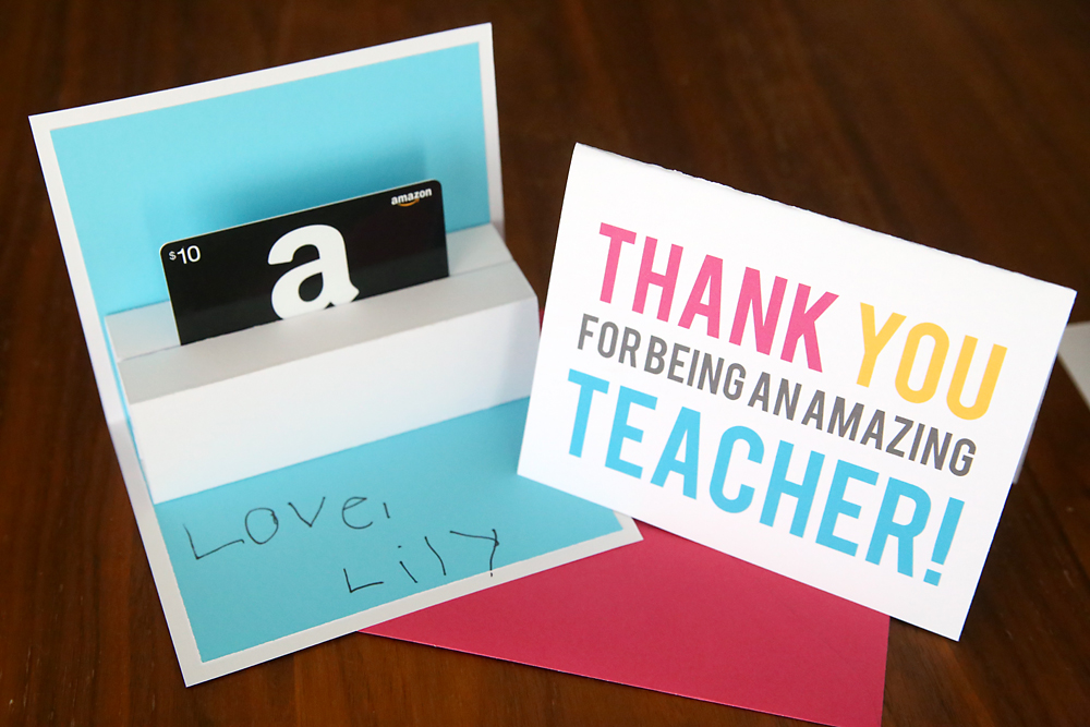 A close up of a teacher appreciation card that holds a gift card that pops up when opened