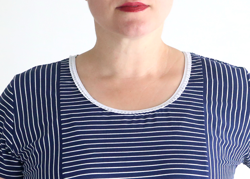 Dress neckline finished with decorative elastic