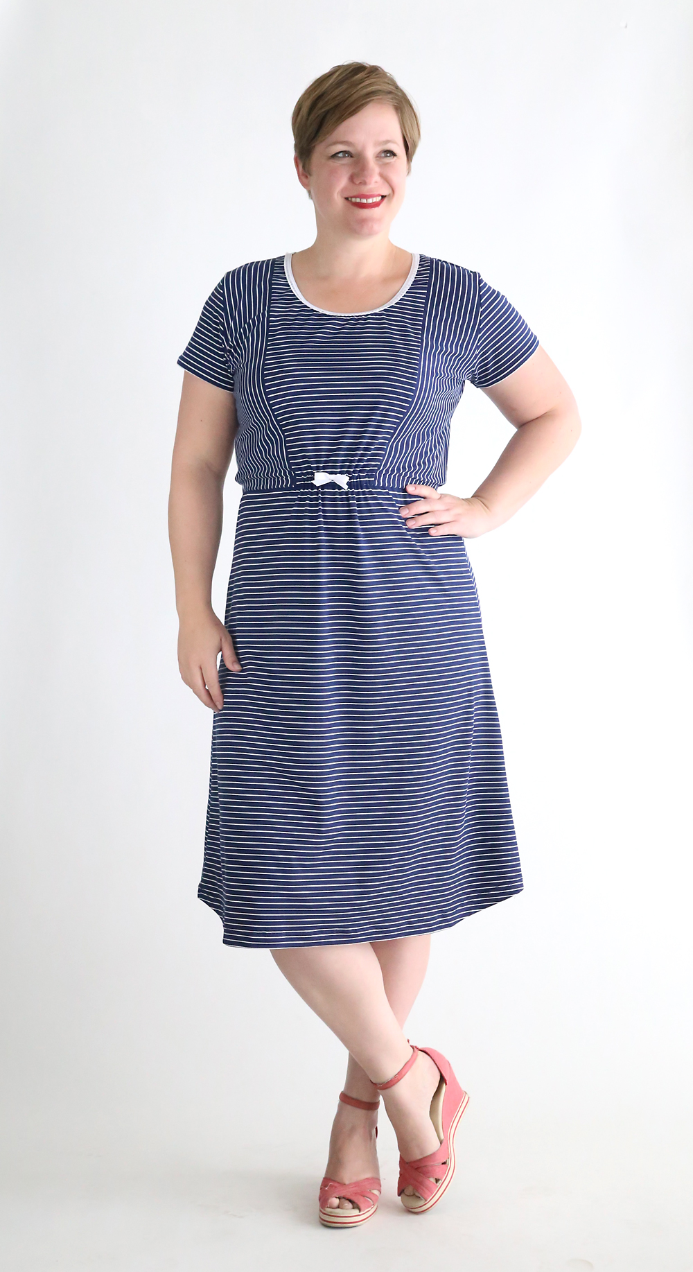 A woman in a striped t-shirt dress made from a free sewing pattern