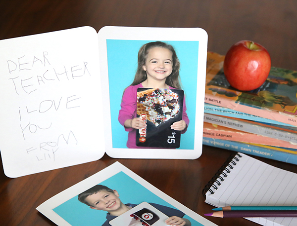 Card with photo of girl holding a gift card inside