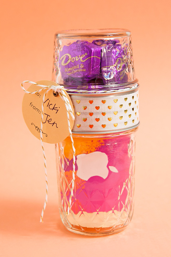 A jar with gift card and chocolates inside for teacher appreciation