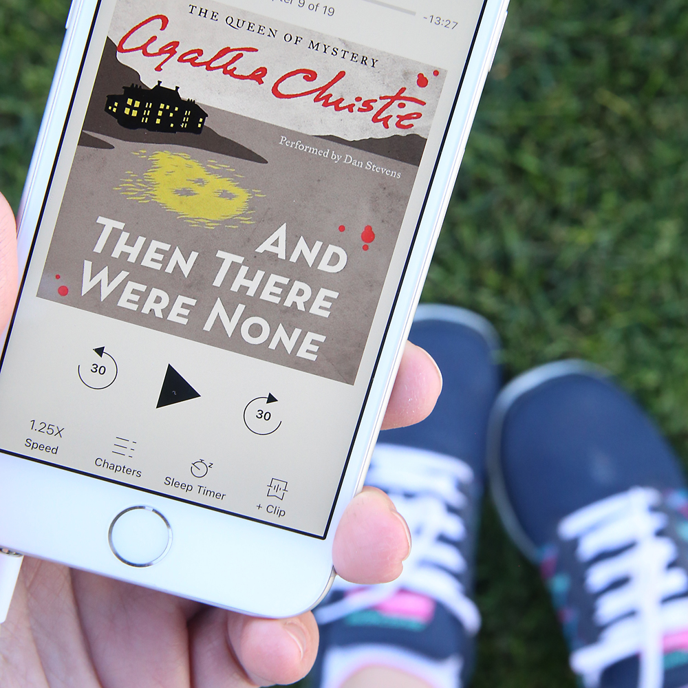 Hand holding a photo with an audiobook loaded to play