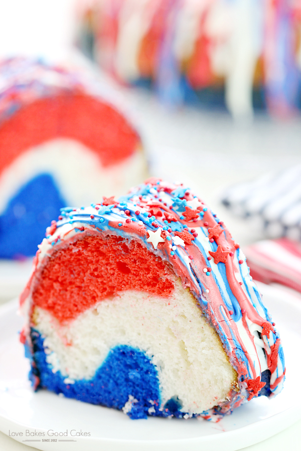 A slice of bundt cake that is colored red, white and blue for Fourth of July
