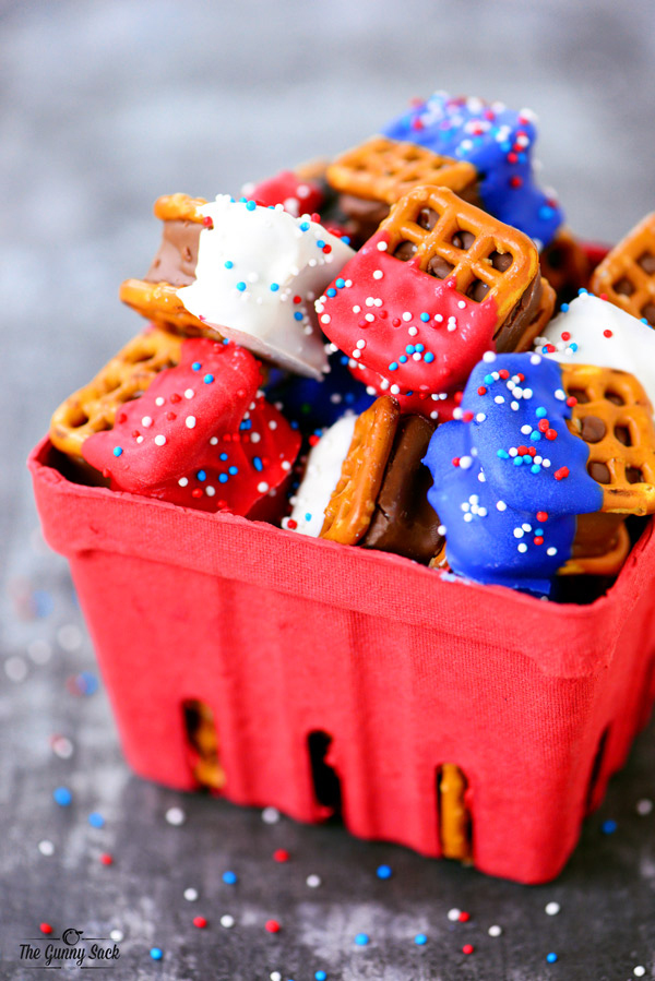 Caramel pretzel sandwiches dipped in red, white and blue candy coating with sprinkles