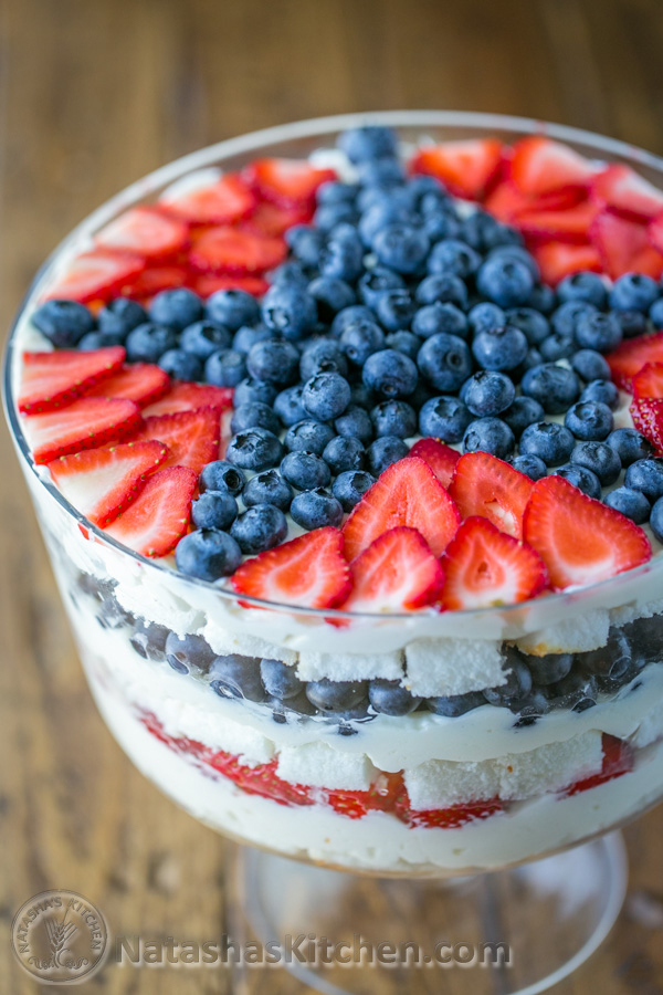 Layered fruit trifle with blueberries and strawberries in the shape of a star on top