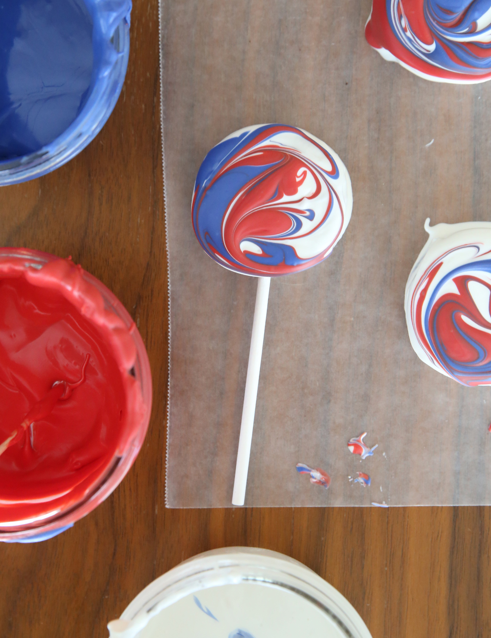 Red white and blue oreo pops with melted red and blue candy melts
