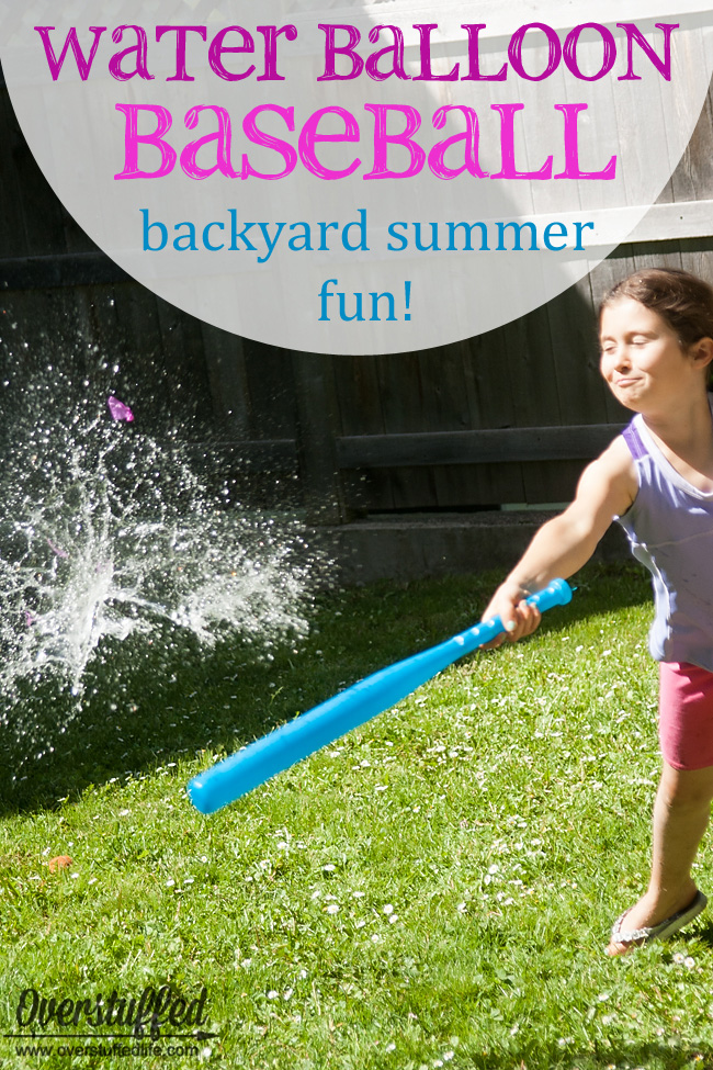 A child playing water balloon baseball