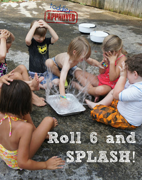 A group of children playing a game where they splash one another with water