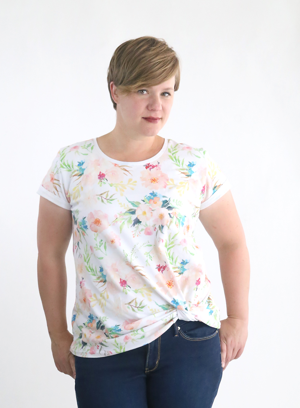 Woman wearing floral t-shirt made from the free twist knot tee sewing pattern