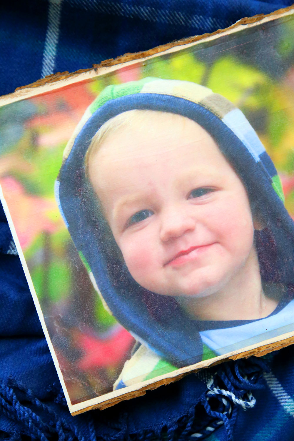 Photo of a child transferred onto a wood plank