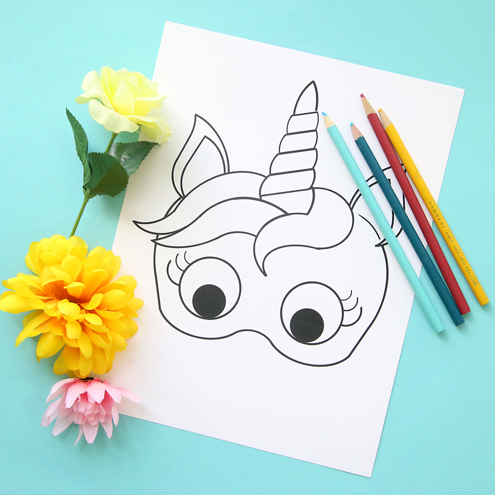 Unicorn mask template with flowers and colored pencils
