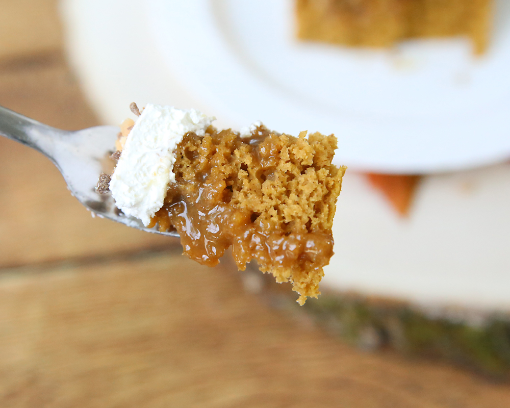 A bite of pumpkin caramel poke cake on a fork