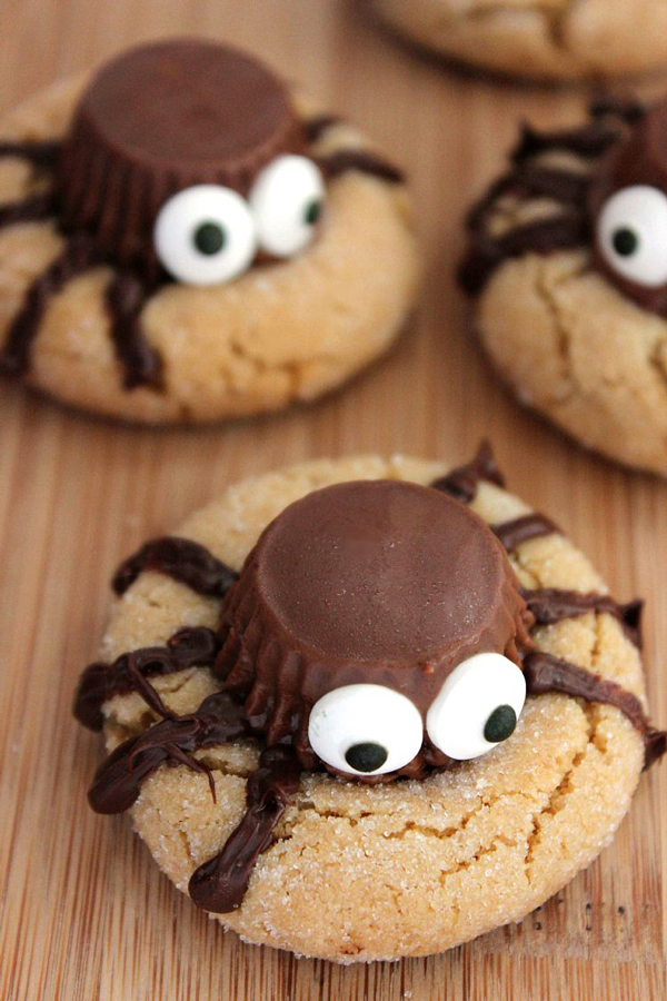 Halloween cookies with spider on top made from Reeses peanut butter cup and candy eyes