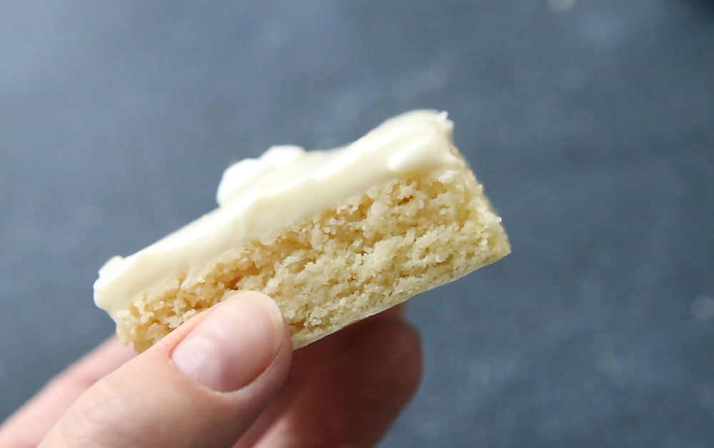 Hand holding a sugar cookie bar