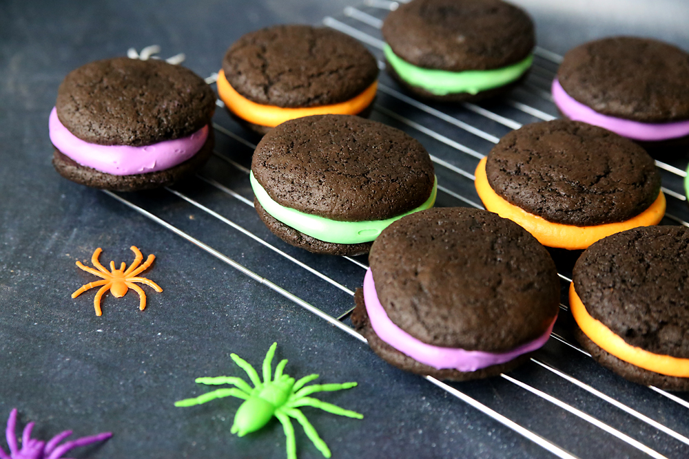 halloween whoopie pies: chocolate cookies sandwiched around yellow, green or purple frosting