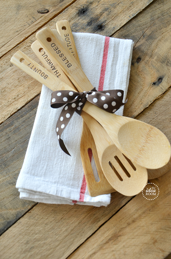 Wooden utensils with words burned on the handles tied with a ribbon for a homemade gift