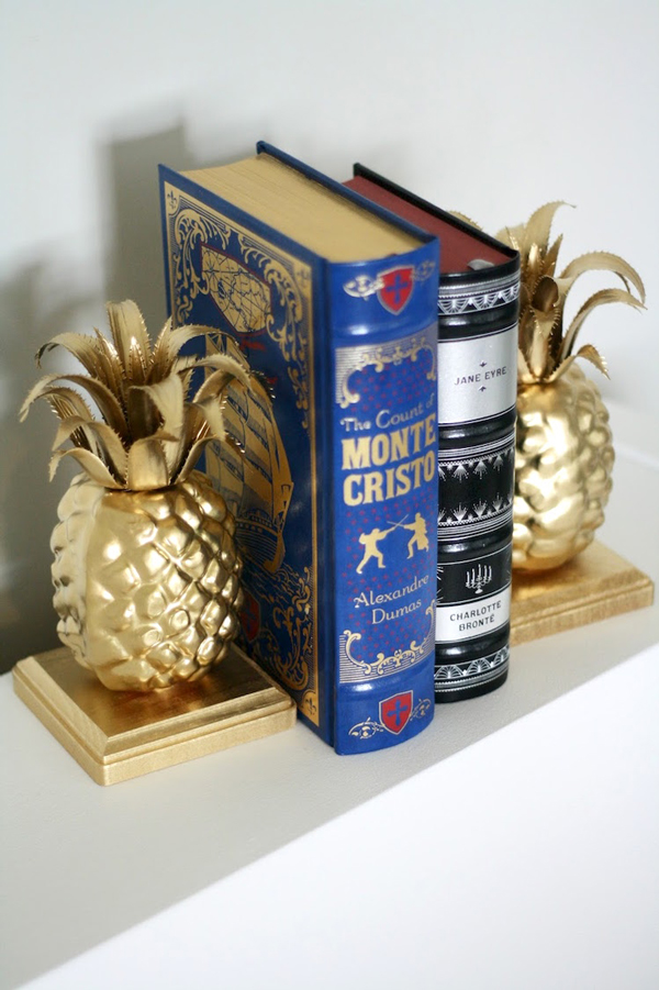 Homemade gold pineapple bookends and books