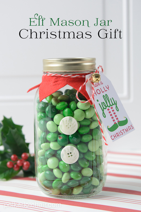 Mason jar filled with green M&Ms decorated to look like an elf Christmas gift