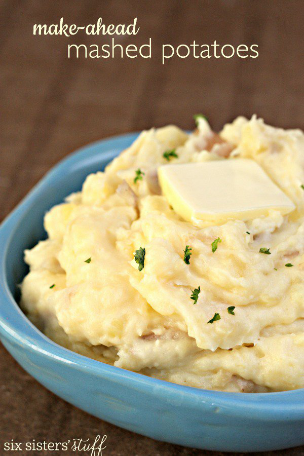 Mashed potatoes in a bowl with butter on top