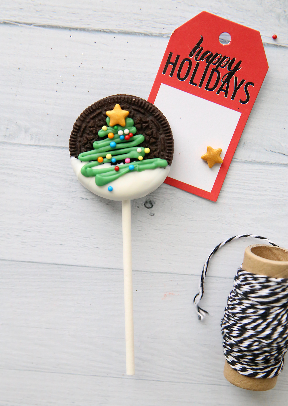 Oreo pop with Christmas tree on it