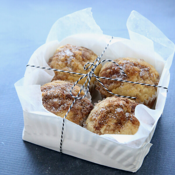 paper plate basket with muffins in it