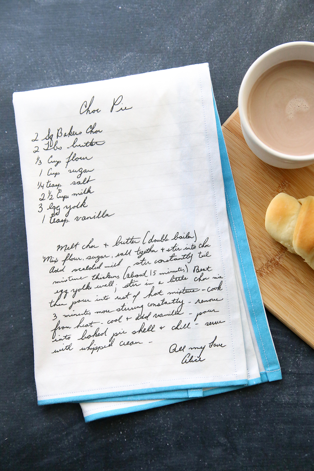 Kitchen towel with handwritten chocolate pie recipe printed on it