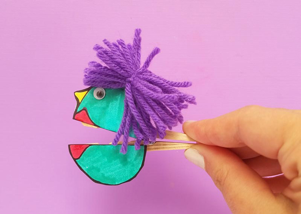 Fun activity for kids: clothespin decorated with colored paper and yarn