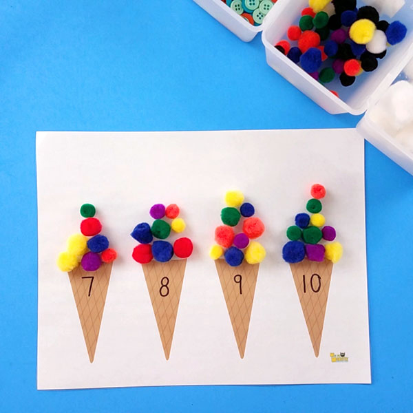 Kids counting activity: paper ice cream cones with numbers and colored pom poms