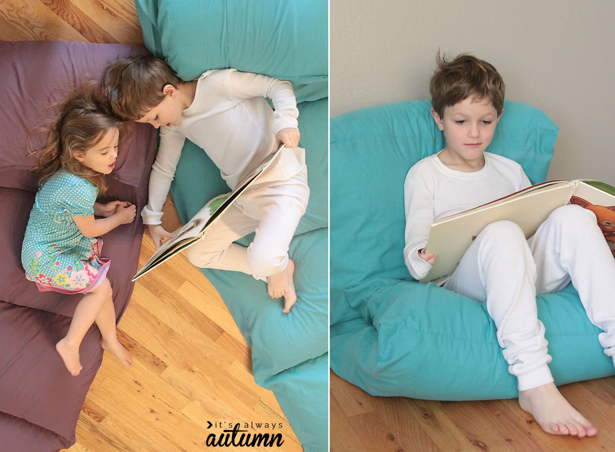 Two young children lounging on pillow beds; little boy reading on a pillow bed that's folded up into a chair