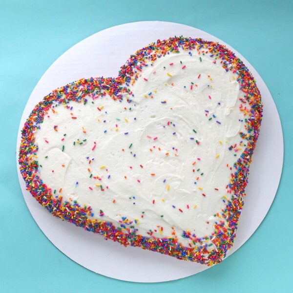 Heart shaped cake with sprinkles.