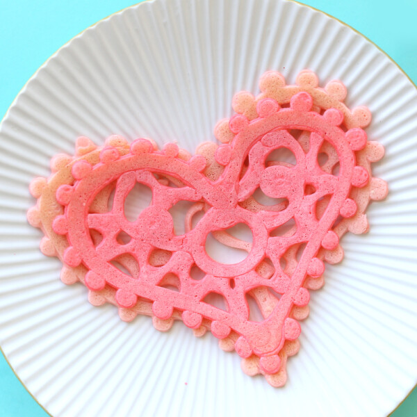 Lace heart shaped pancakes are a fun breakfast idea for Valentine's Day! Valentines recipe to make with kids.