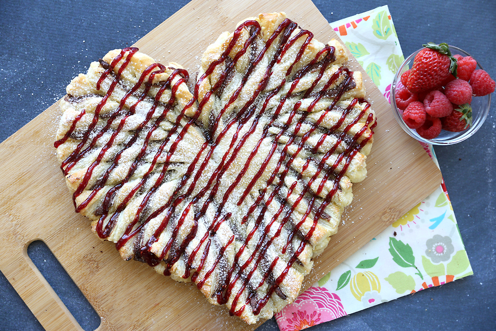 This raspberry nutella puff pastry heart is an easy Valentine's dessert everyone will love! Quick and easy recipe.