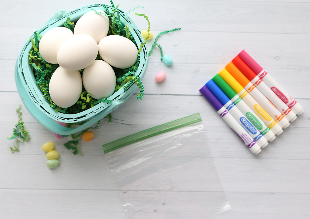 Eggs in a basket with sandwich bag and markers