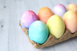 Watercolor eggs in an egg carton