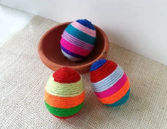 Eggs wrapped in colorful yarn