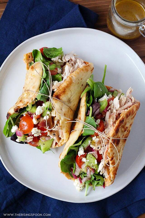 Chicken hummus naan wraps on a plate