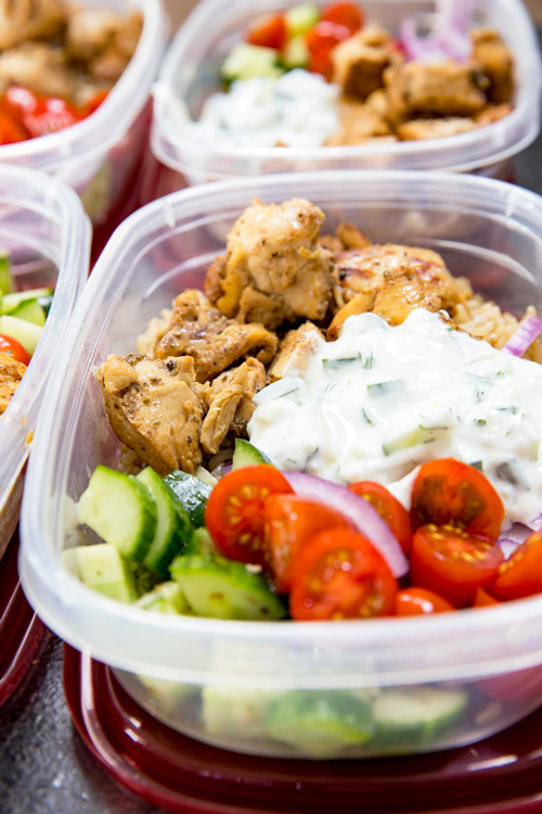 Greek chicken bowl with yogurt sauce, cucumbers and tomatoes