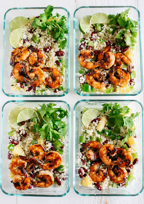 Caribbean jerk shrimp with cauliflower rice, lime slices and cilantro