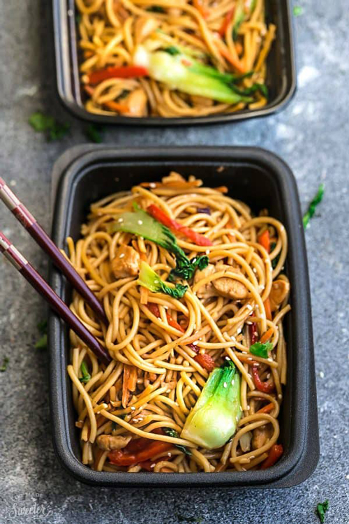 Healthy chicken lo mein and vegetables in a meal prep container