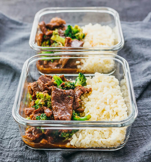 Instant pot beef and broccoli with rice in a square meal prep container