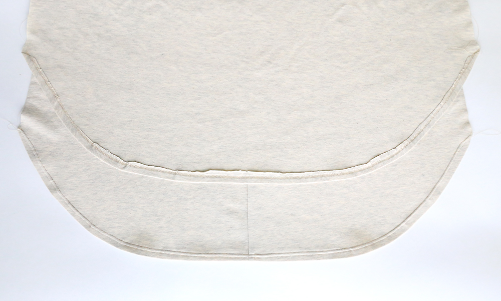 Curved hem at the bottom of a long t-shirt