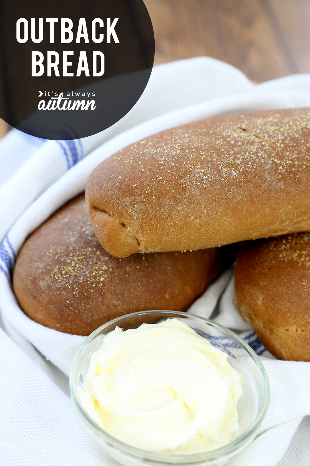 Small loaves of sweet brown bread on a towel with butter