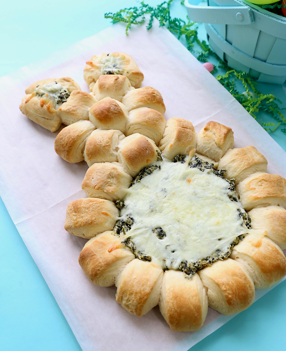 Easter bunny spinach dip appetizer, made with rolls in a bunny shape with spinach dip in the center